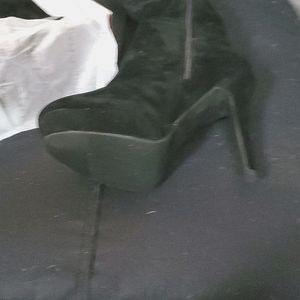 Black high heel boots made by LILIANA